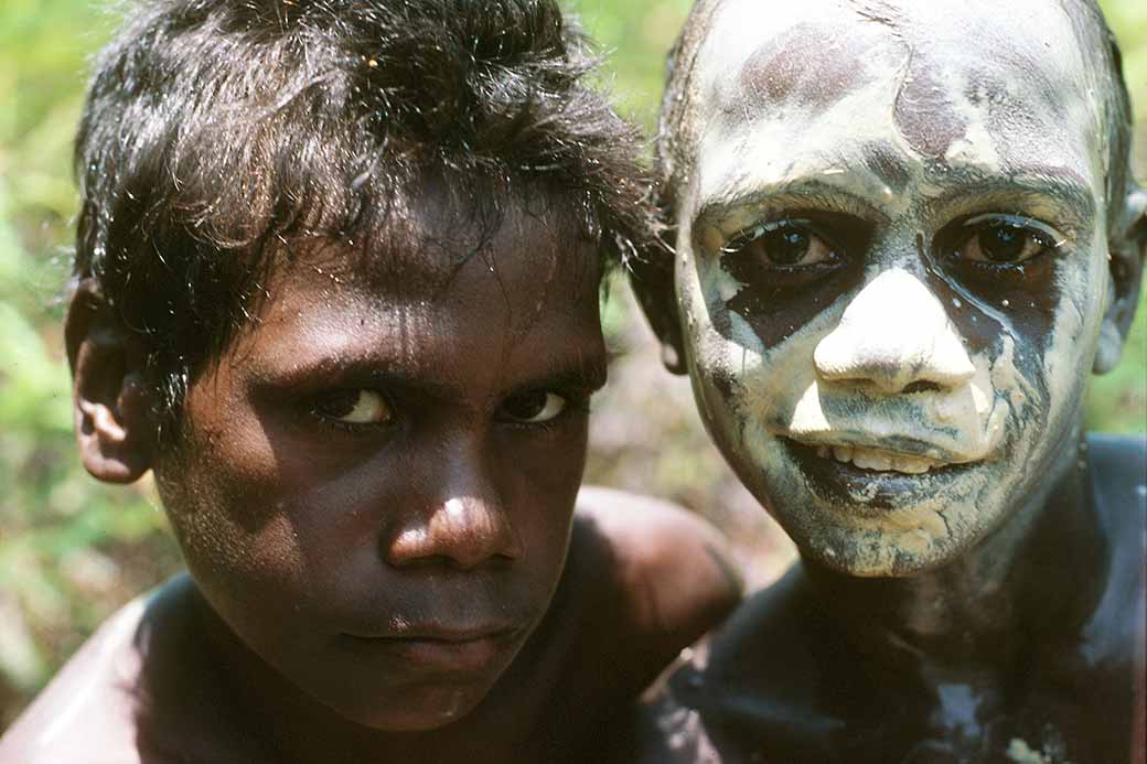 Tiwi boys with clay