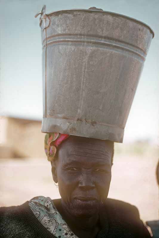 Woman with bucket, Molepolole