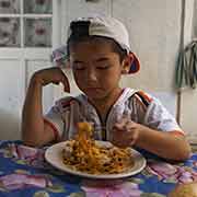 Boy eating noodles