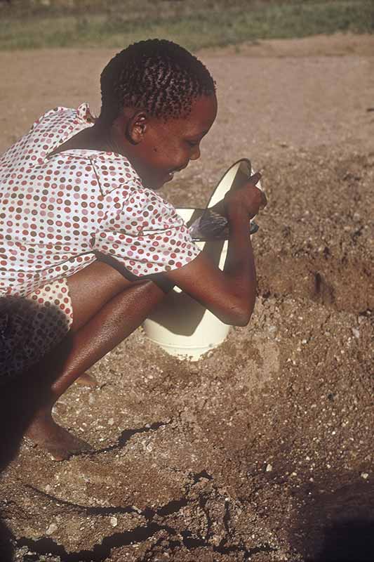 Girl collecting water, Moshupa