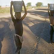 Boys carrying buckets, Molepolole