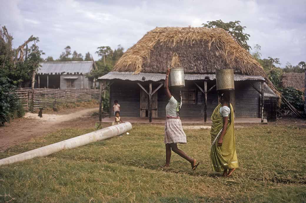 Women carrying water, Belle Mare