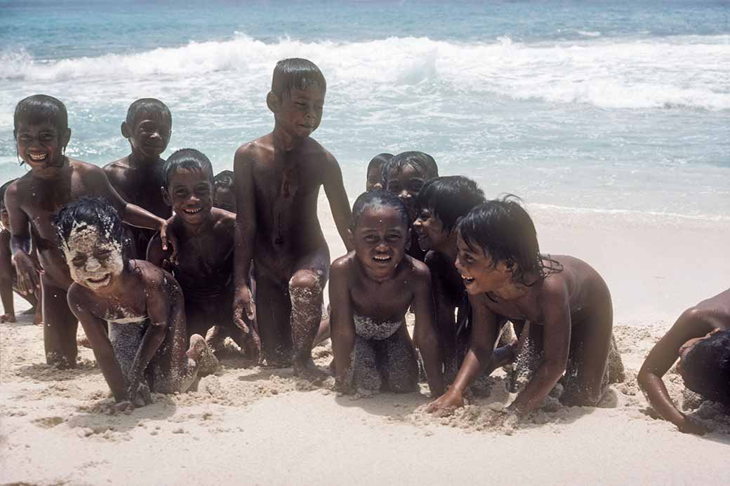 Children posing on the beach, Onari