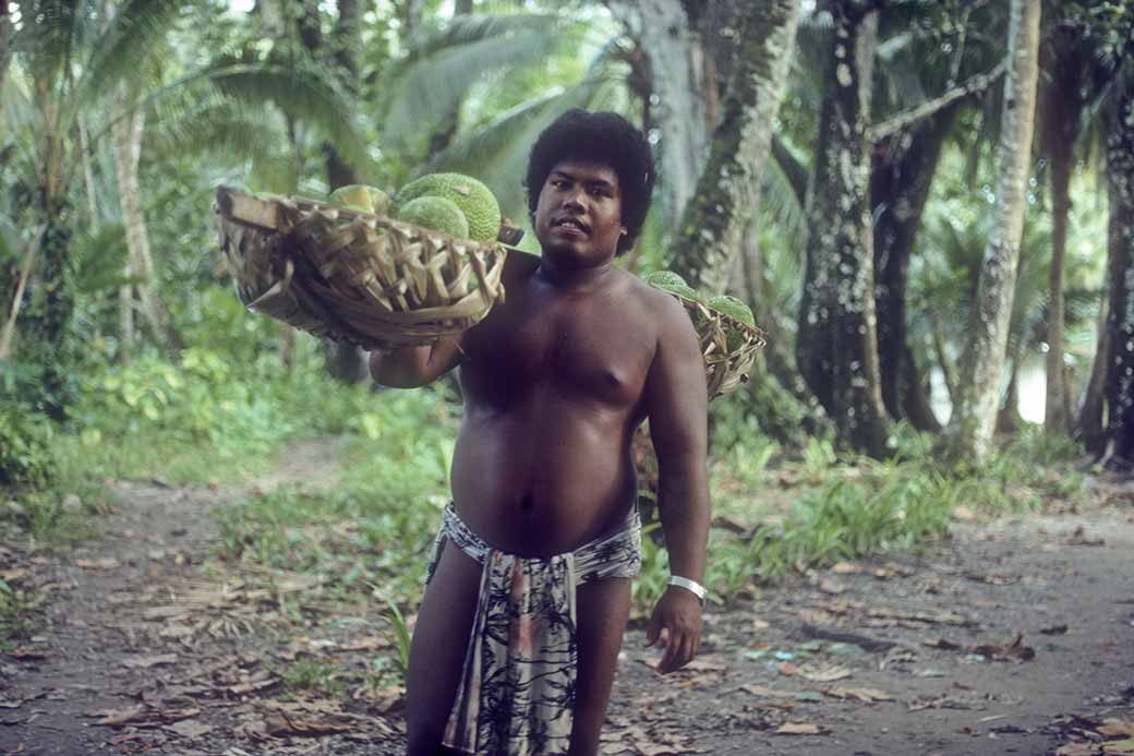 Man carrying breadfruit