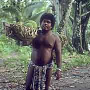 Man carrying breadfruit