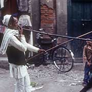 Playing a long horn, Kathmandu