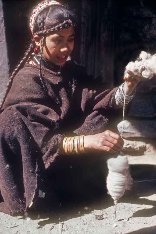 Kalash girl spinning wool