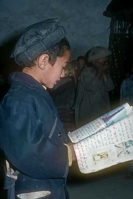 Boy reading in Urdu