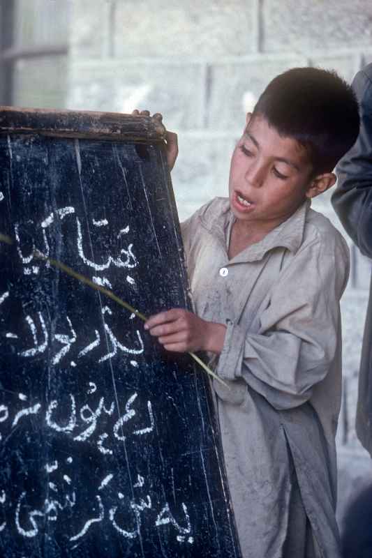 Boy reading Urdu