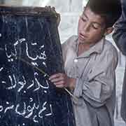 Boy reading Urdu
