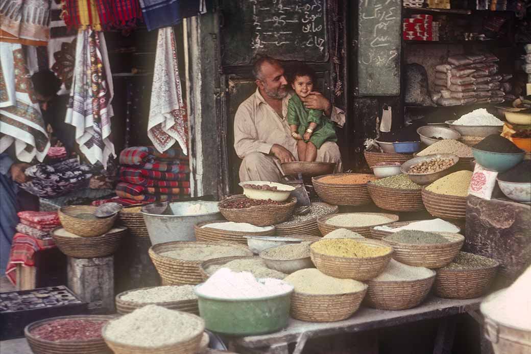 Shopkeeper with his daughter