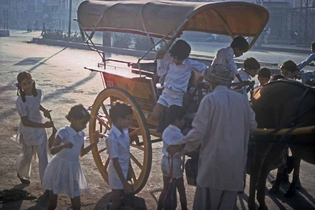 School children arriving by tonga