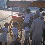 School children arriving by tonga