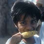 Girl, corn on the cob
