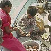 Boys eating crabs