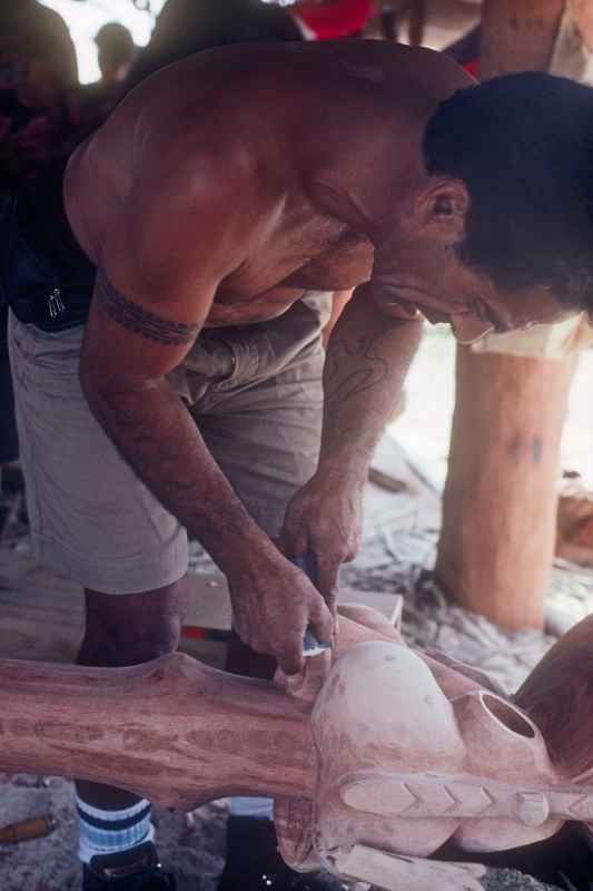 Woodcarver making paoa