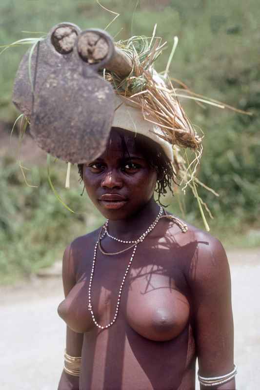 Mpondo girl carrying a hoe