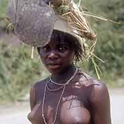 Mpondo girl carrying a hoe