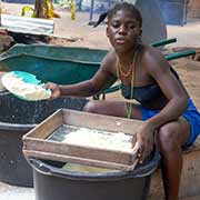 Sifting manioc flour, Malinka