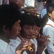 Boys playing flutes