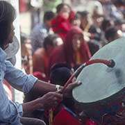 Playing the 'Dhyangro' drum