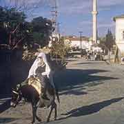 Woman riding donkey